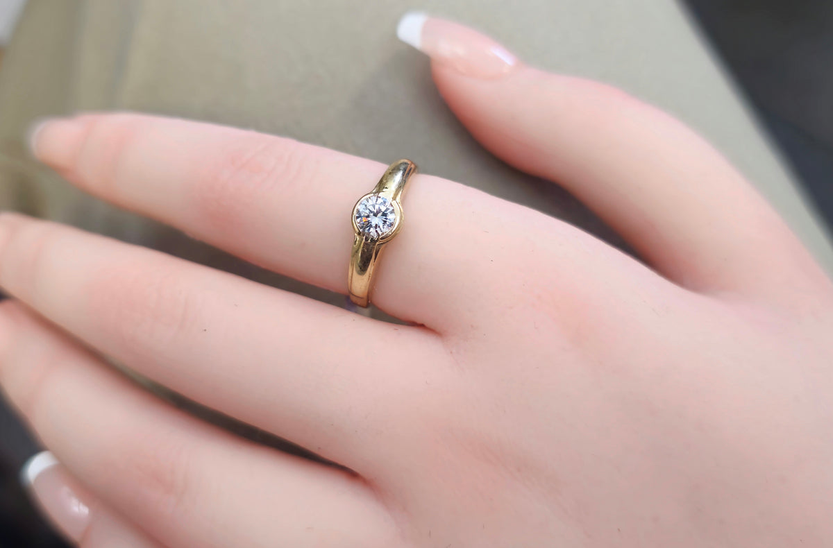 18-karat yellow gold half bezel diamond ring