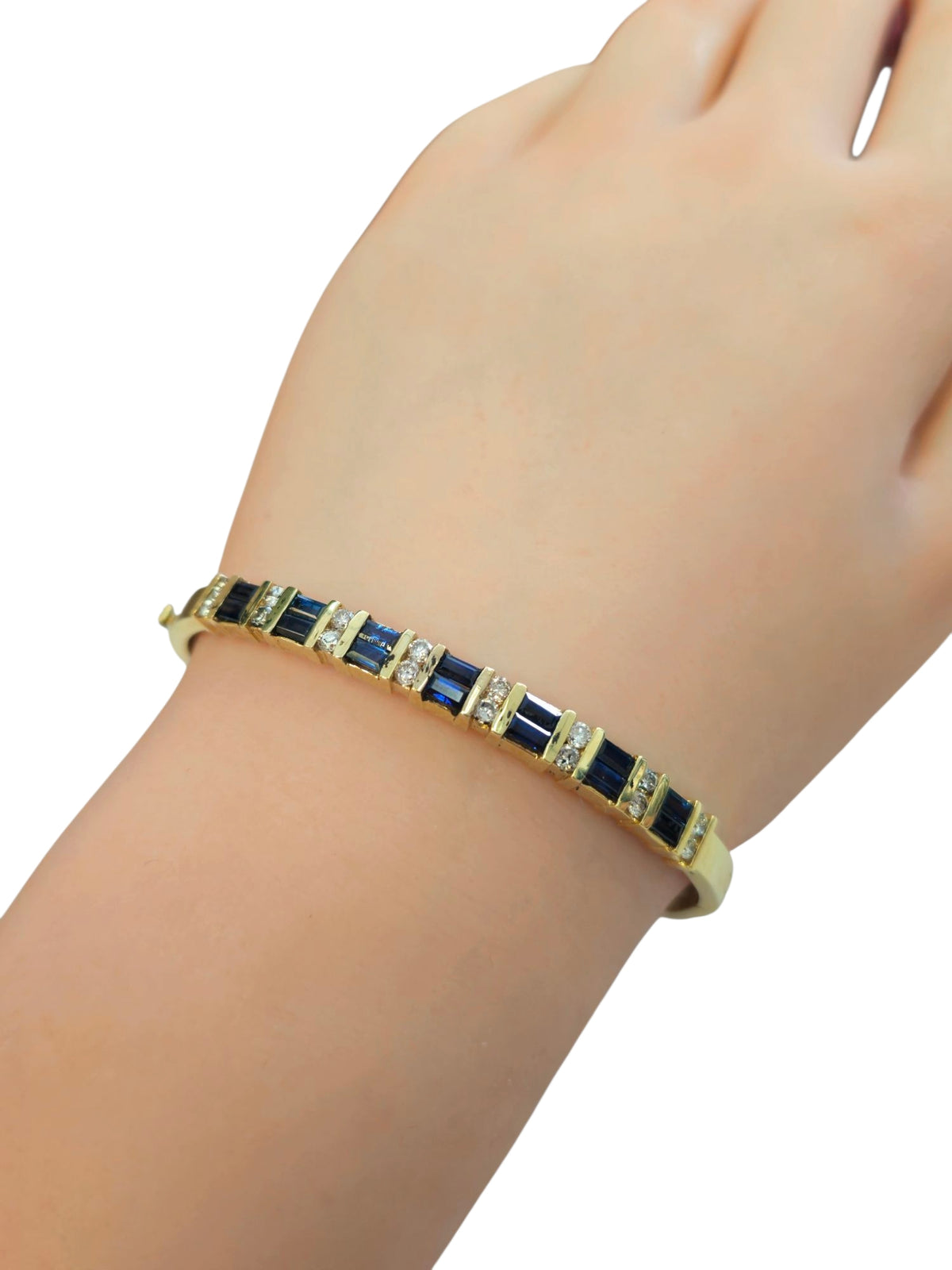 Circa 1980 Sapphire and Diamond Bangle Bracelet in 14 Karat Yellow Gold