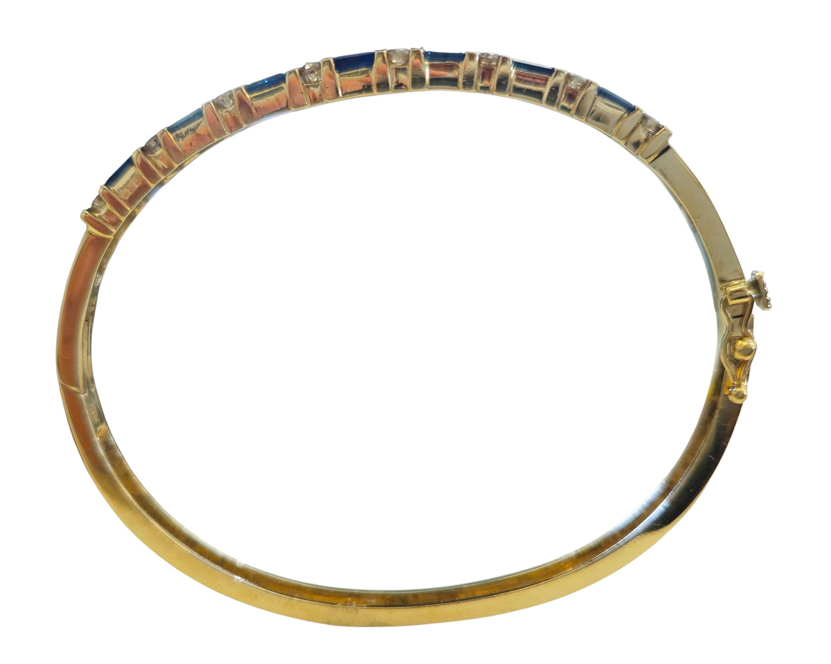 Circa 1980 Sapphire and Diamond Bangle Bracelet in 14 Karat Yellow Gold