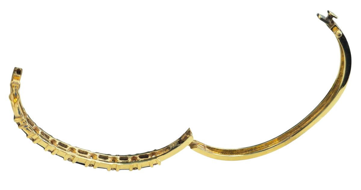 Circa 1980 Sapphire and Diamond Bangle Bracelet in 14 Karat Yellow Gold