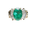 Oval-Cut Emerald and Bow Tie Style Baguette Cut Diamond Ring made in 14-Karat Yellow and White Gold