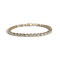 Bezeled Emerald Lab Grown Diamond Tennis Bracelet in 14 Karat Yellow Gold