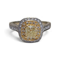 Fancy Yellow Cushion Cut Center Diamond with Pave set Halo Engagement Ring in 18 Karat Yellow and White Gold
