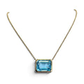 East West Emerald Cut Blue Topaz Necklace in 14 Karat Yellow Gold