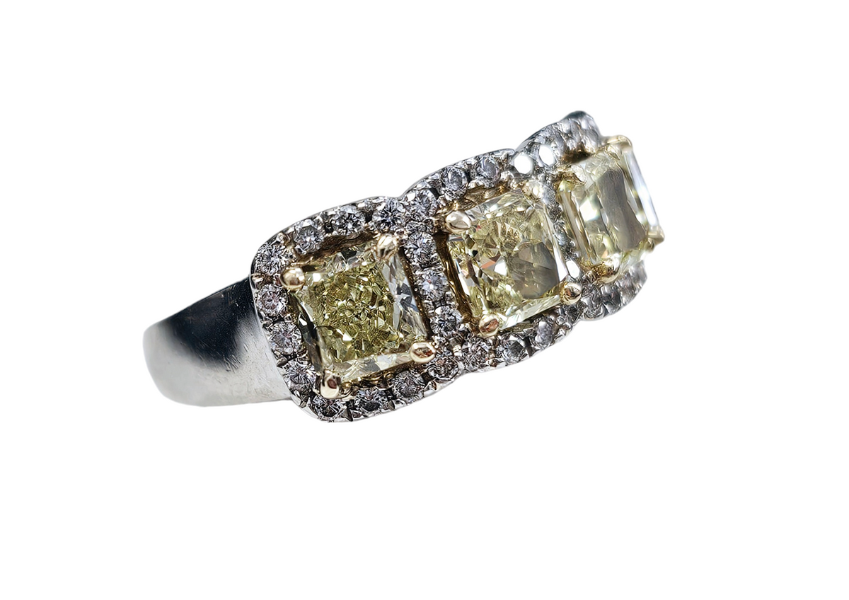 Diamond Ring, 4 Yellow Radiant Cut Diamonds, Total Carats 2.20, surrounded by 47 Round Cut Diamonds, 0.45 Carats Platinum Ring