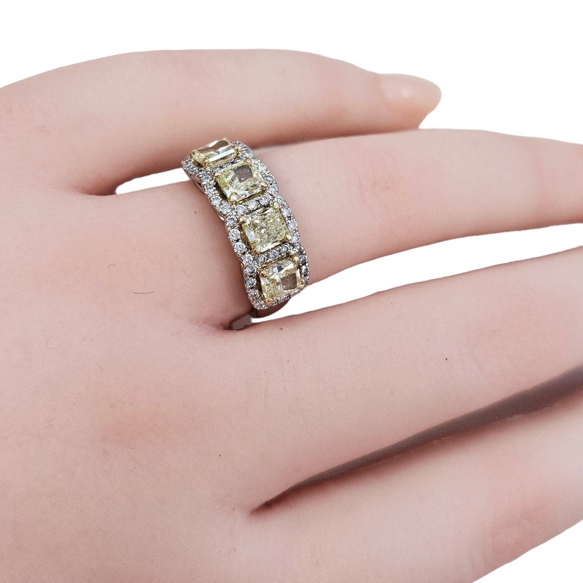 Diamond Ring, 4 Yellow Radiant Cut Diamonds, Total Carats 2.20, surrounded by 47 Round Cut Diamonds, 0.45 Carats Platinum Ring