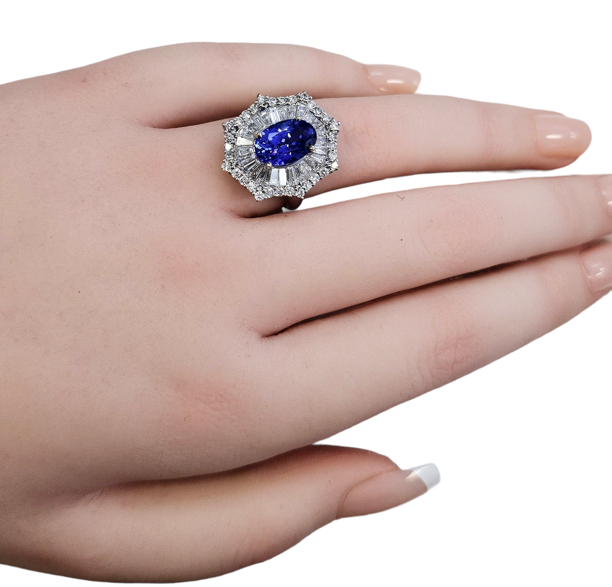 Oval Tanzanite with Diamond Baguette and Round Brilliant Cut Ballerina Skirt made in 18-Karat White Gold