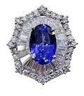 Oval Tanzanite with Diamond Baguette and Round Brilliant Cut Ring Ballerina Skirt made in 18-Karat White Gold
