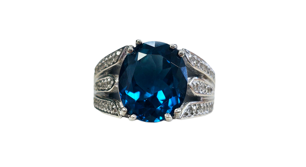Oval-Shaped London Blue Topaz and Diamond Ring with Double Split Shank made in 10-Karat White Gold
