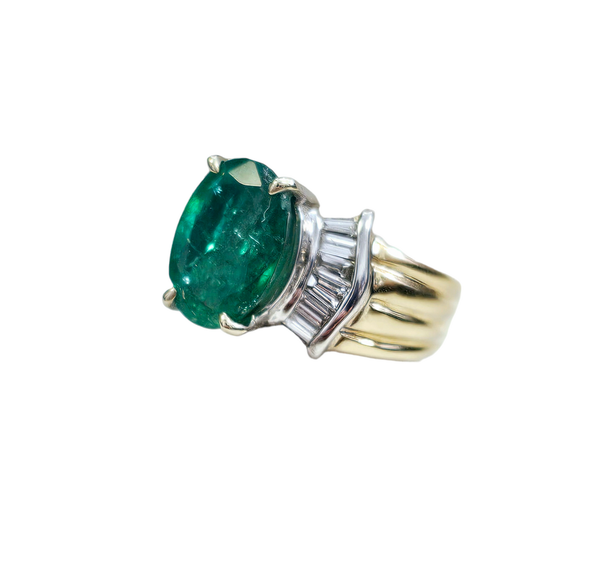 Oval-Cut Emerald and Bow Tie Style Baguette Cut Diamond Ring made in 14-Karat Yellow and White Gold