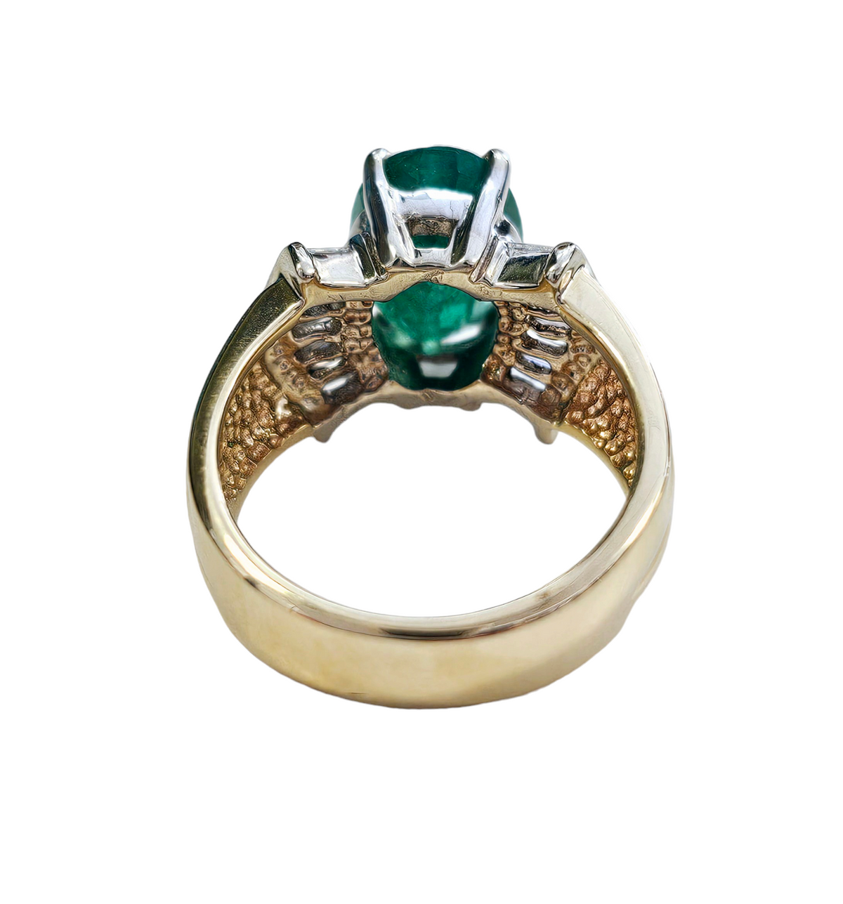 Oval-Cut Emerald and Bow Tie Style Baguette Cut Diamond Ring made in 14-Karat Yellow and White Gold
