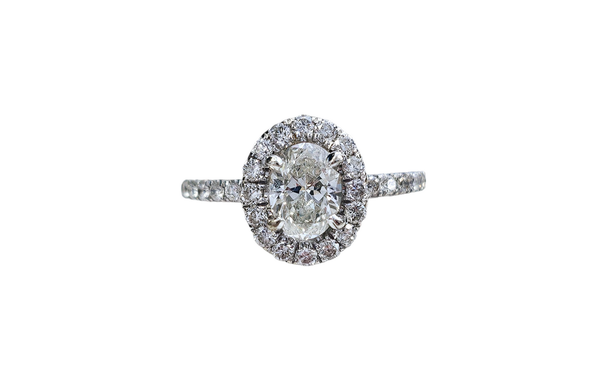 0.75 CT Oval Cut Diamond Engagement Ring with Diamond Halo and Half Shank made in 14-Karat White Gold
