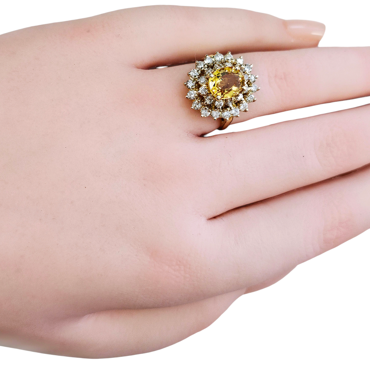 Oval Cut Yellow Sapphire with a Double Diamond Halo made in 14-Karat Yellow Gold