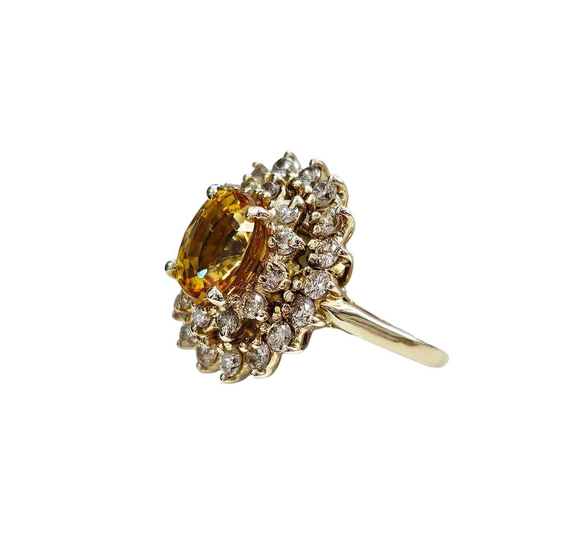 Oval Cut Yellow Sapphire with a Double Diamond Halo made in 14-Karat Yellow Gold