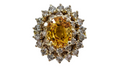 Oval Cut Yellow Sapphire with a Double Diamond Halo made in 14-Karat Yellow Gold
