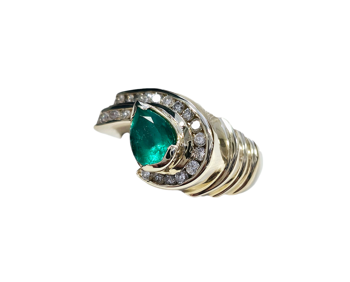 Pear Shape Columbian Emerald and Channel Set Diamond Ring made in 14-Karat Yellow Gold