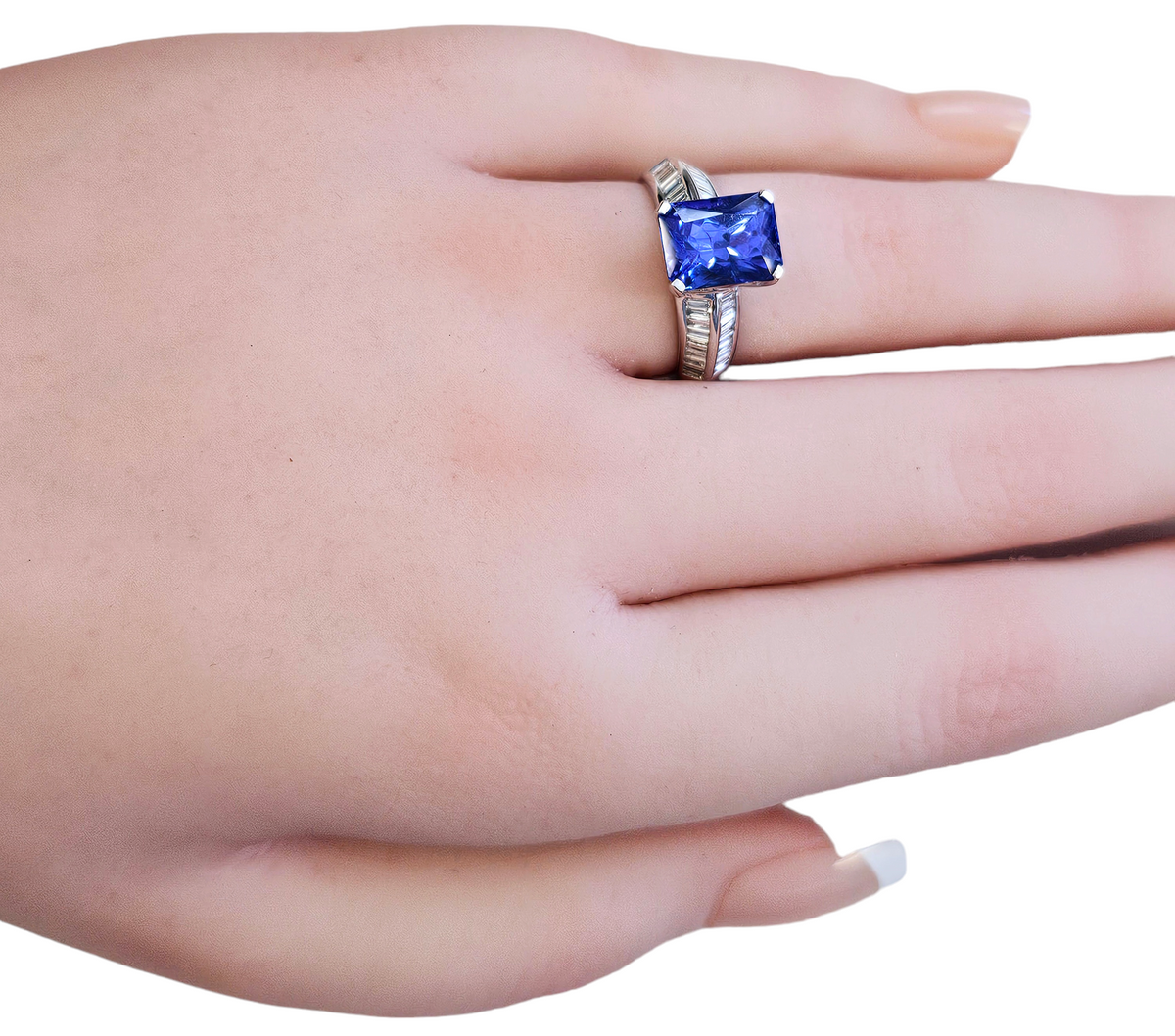 Radiant Cut Tanzanite and Channel Set Baguette Diamond Ring made in 18-Karat White Gold