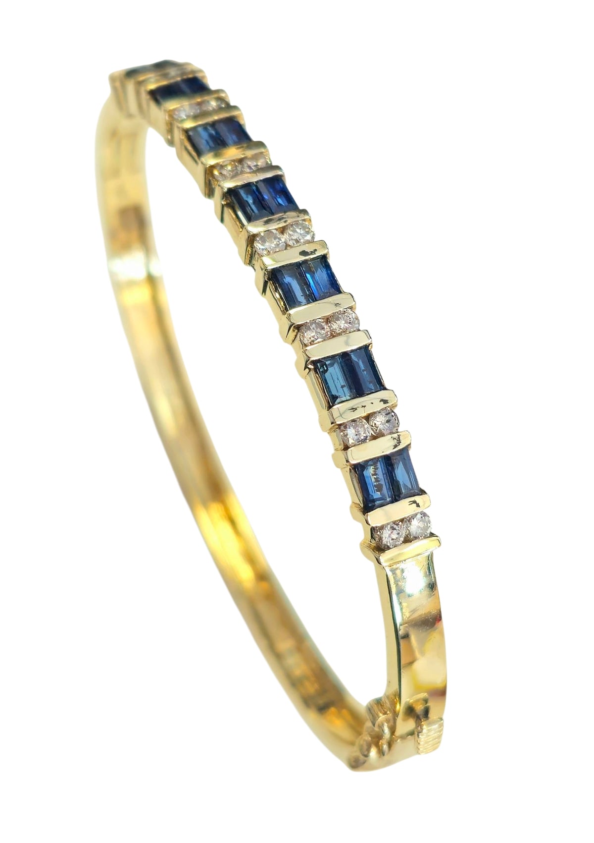 Circa 1980 Sapphire and Diamond Bangle Bracelet in 14 Karat Yellow Gold