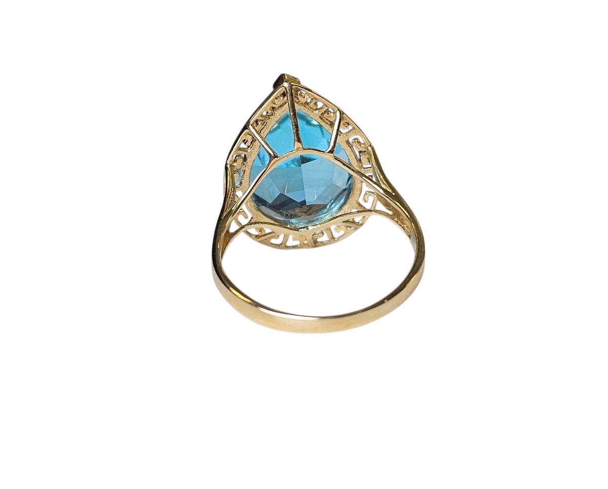 Pear Shape Blue Topaz Ring in 14 Karat Yellow Gold
