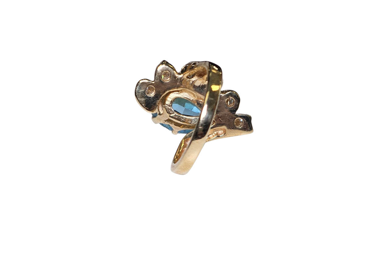 Oval Diamond Blue Topaz Ring in 14 Karat Yellow Gold