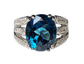 Oval-Shaped London Blue Topaz and Diamond Ring with Double Split Shank made in 10-Karat White Gold