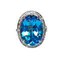 Oval Blue Topaz with Diamond in 18 Kt White Gold Ring