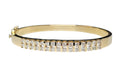 Double channel set bracelet bangle made in solid 14-karat yellow gold