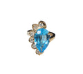 Oval Diamond Blue Topaz Ring in 14 Karat Yellow Gold