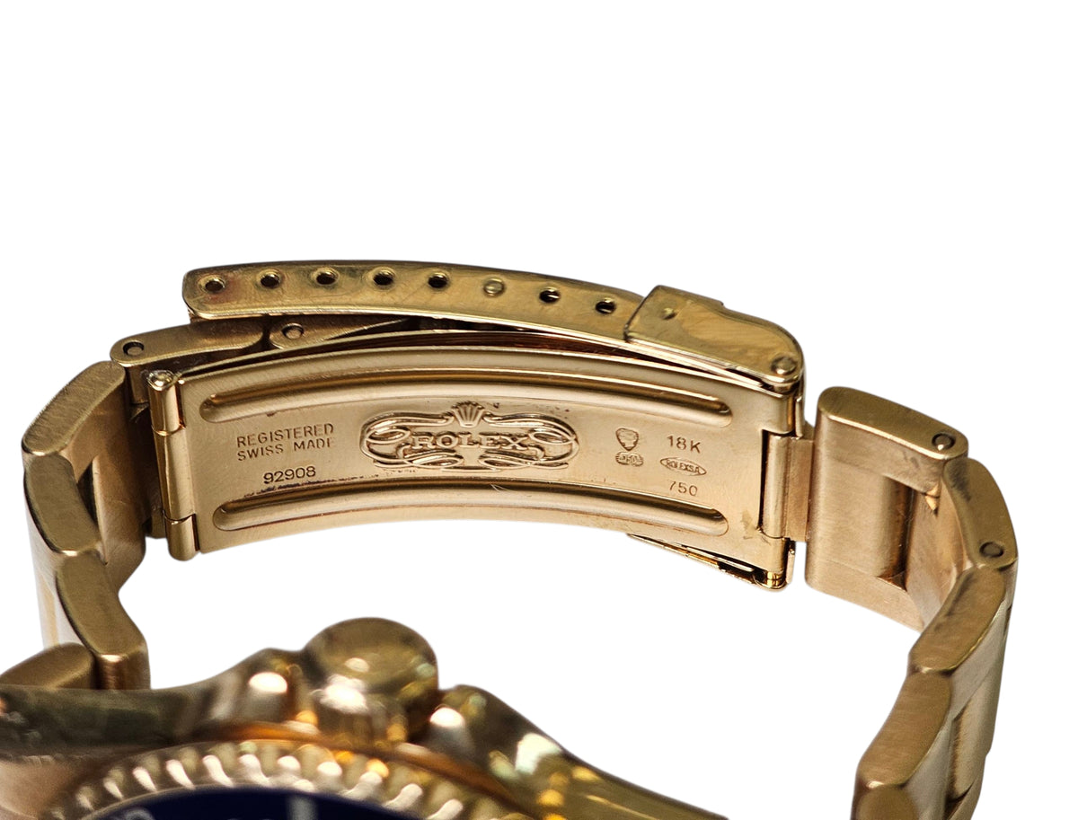 ROLEX SUBMARINER WATCH IN 18 KARAT YELLOW GOLD, BLUE ON BLUE