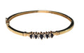 Blue Sapphire and Diamond Bangle Bracelet in 14 Karat Yellow Gold